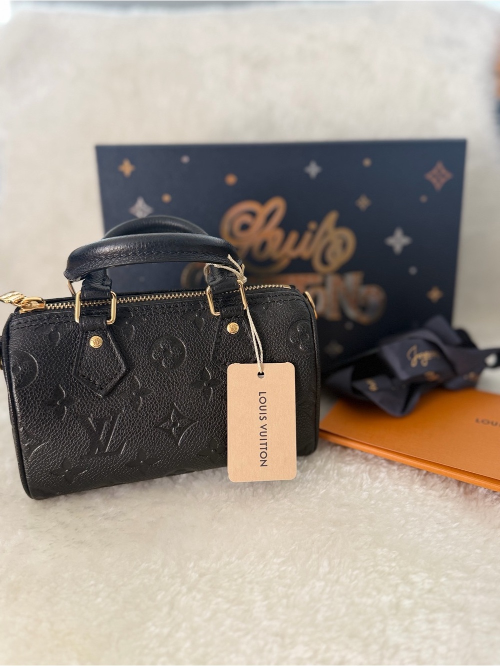 Louis Vuitton Black Embossed Monogram Mini Handbag with Gold Hardware